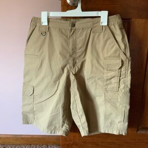 Men’s three pair of shorts, the two tan ones are size 34 and the black are 35